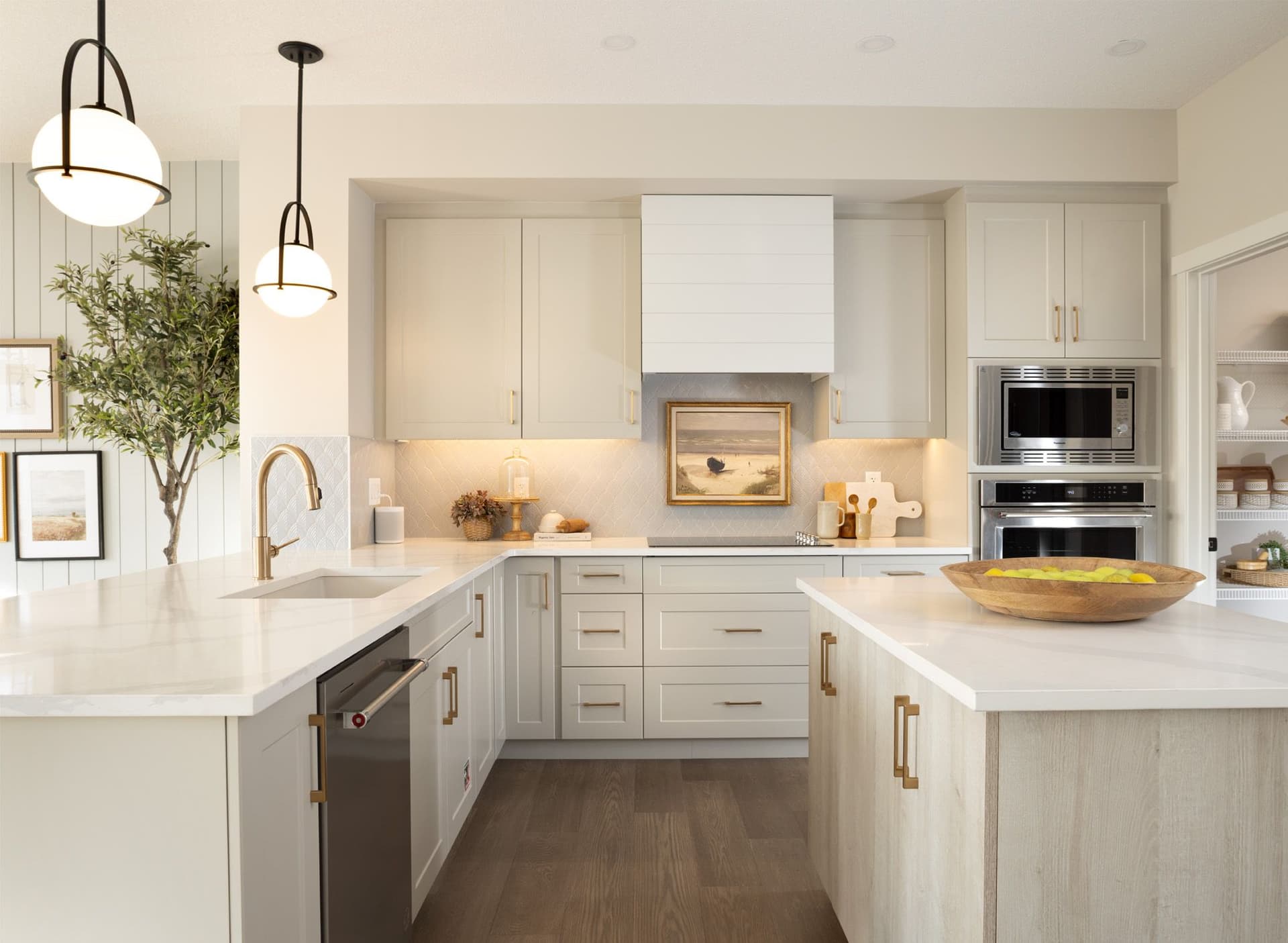 The clean, bright kitchen in the Mahogany Castella, with pale wood cabinets.